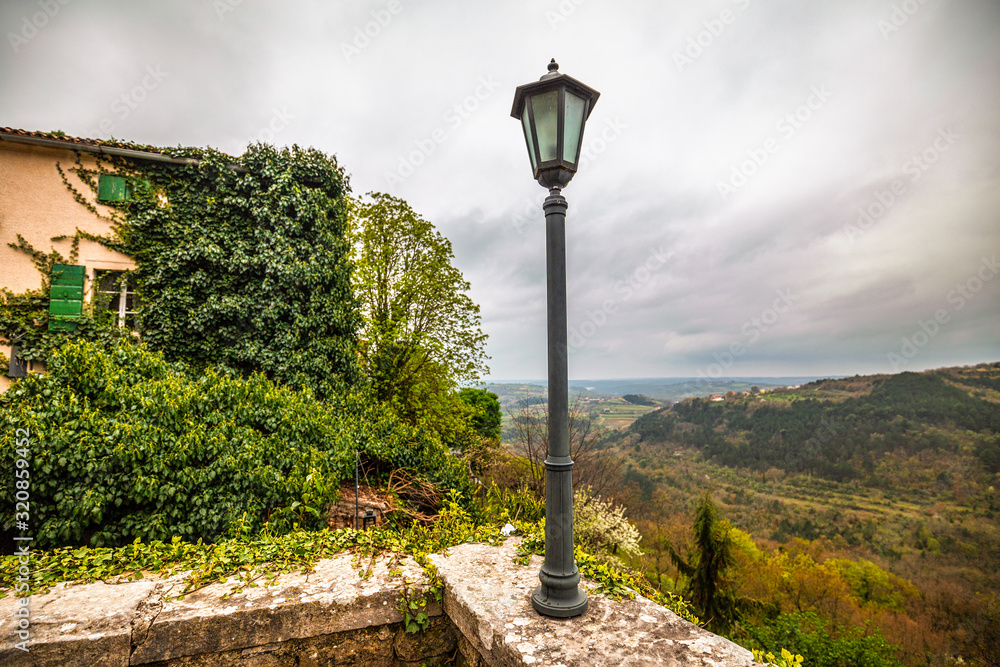 View from the ancient village to the surrounding countryside. The Groznjan village on Istria in Croatia, Europe. View from the ancient village to the surrounding countryside. The Groznjan village on Istria in Croatia, Europe.