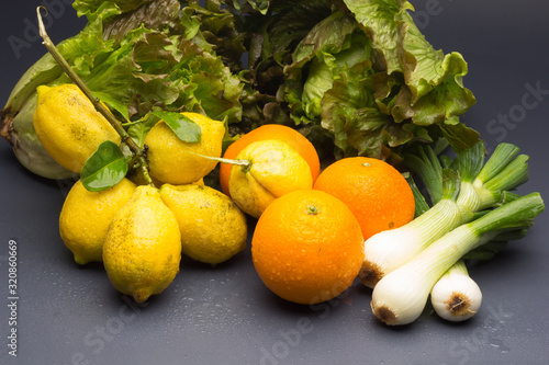 Still life of Lemons and oranges and other vegetables