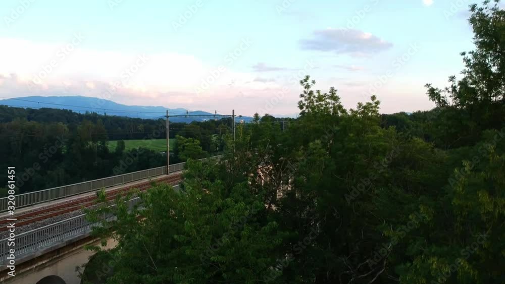 Reveal of a bridge over a small lake.