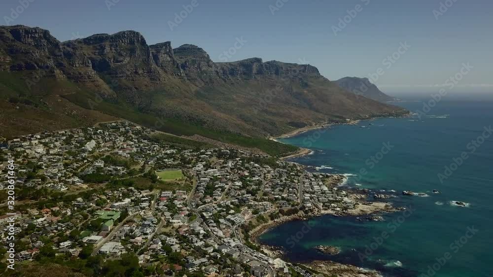 Aerial view looking down on Camps Bay and Bakoven communities in South Africa. Aerial view looking down on Camps Bay and Bakoven communities in South Africa.