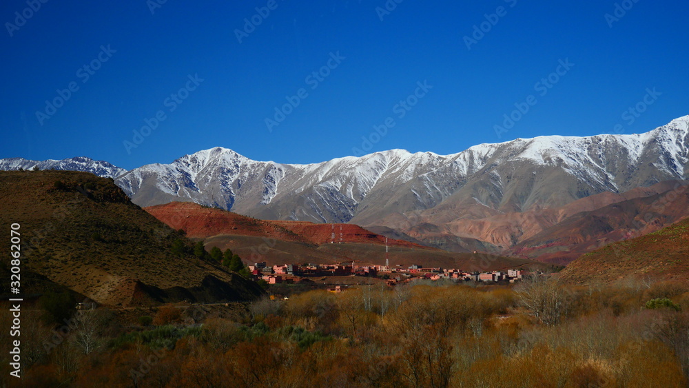 Bright landscape of Morocco, breathtaking curves of mountains, stunning combination of hills & farm land,inadvertent distribution of houses & huts, raw impression of pure nature. Bright landscape of Morocco, breathtaking curves of mountains, stunning combination of hills & farm land,inadvertent distribution of houses & huts, raw impression of pure nature.