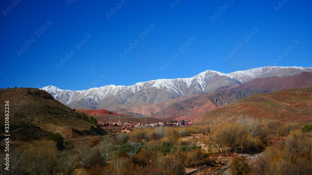 Bright landscape of Morocco, breathtaking curves of mountains, stunning combination of hills & farm land,inadvertent distribution of houses & huts, raw impression of pure nature. Bright landscape of Morocco, breathtaking curves of mountains, stunning combination of hills & farm land,inadvertent distribution of houses & huts, raw impression of pure nature.