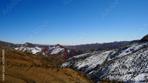 Bright landscape of Morocco, breathtaking curves of mountains, stunning combination of hills & farm land,inadvertent distribution of houses & huts, raw impression of pure nature.