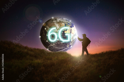 The shadow of the male traveler who touched the world, that is the goal of the development of anaerobic communication system in the system 6g. The composition of this image is decorated by Nasa. photo