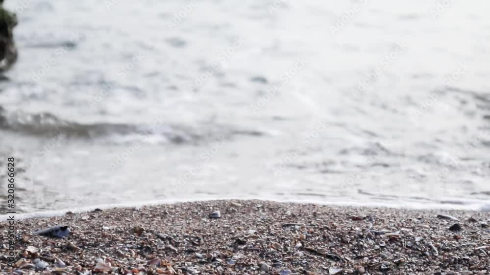 Sea waves coast. Crystal water waves crash into the sandy shore. Sea waves coast. Crystal water waves crash into the sandy shore.