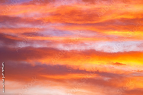 Red and yellow clouds in the sunset sky © onyx124