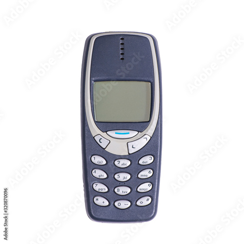 Old mobile phone on a white background. Isolated photo