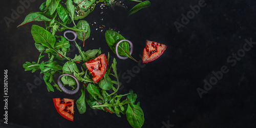 Healthy salad, leaves mix salad (mix micro greens, cucumber, tomato, onion, other ingredients). food background. copy space