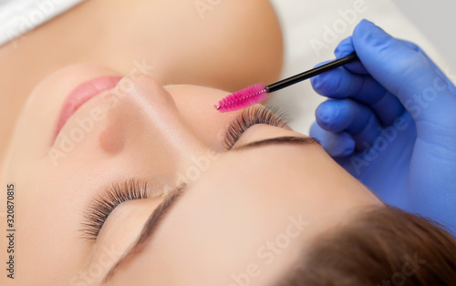 Fotografija Eyelash extension procedure close up