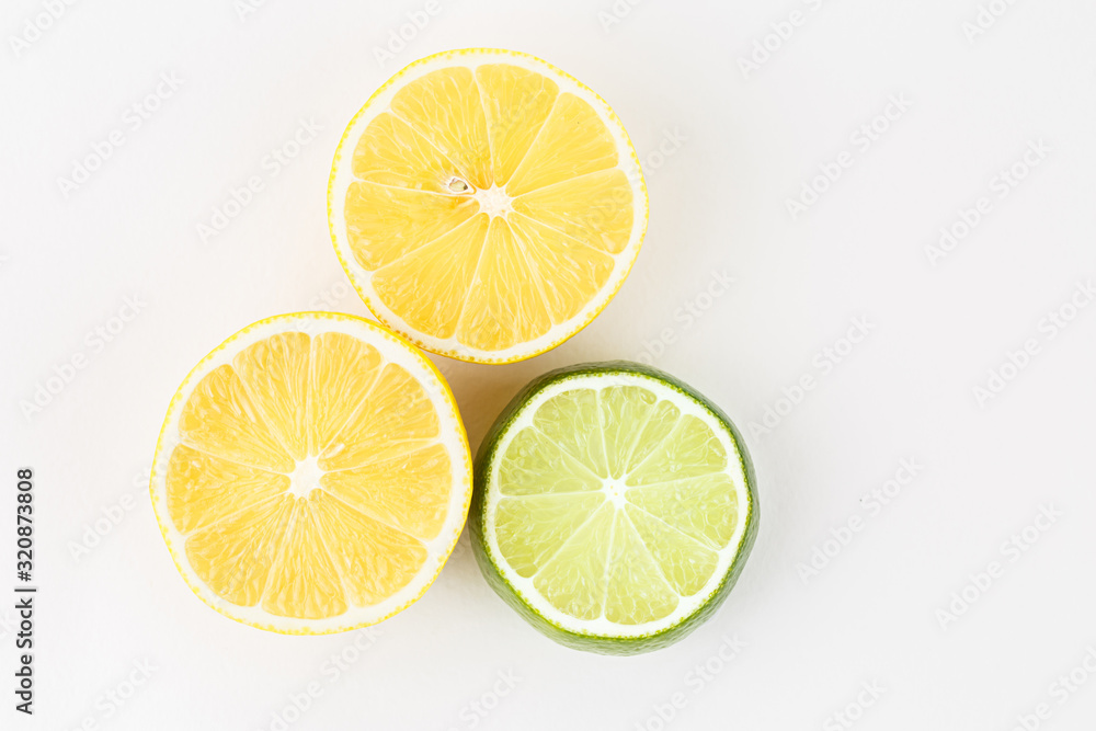 Fresh slices of orange lime on a white background.