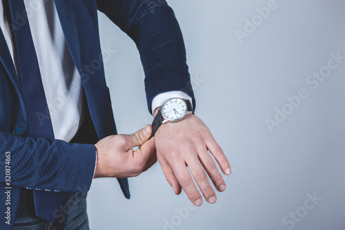 man hand holding elegant watch