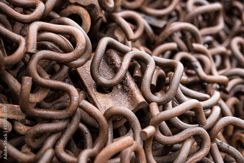 Rusty metal collected for recycling. Pile of old railway metal clips Rusty metal collected for recycling. Pile of old railway metal clips