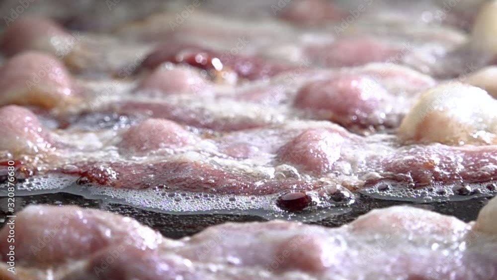 Bacon Frying on the Griddle in Slow Motion Bacon Frying on the Griddle in Slow Motion