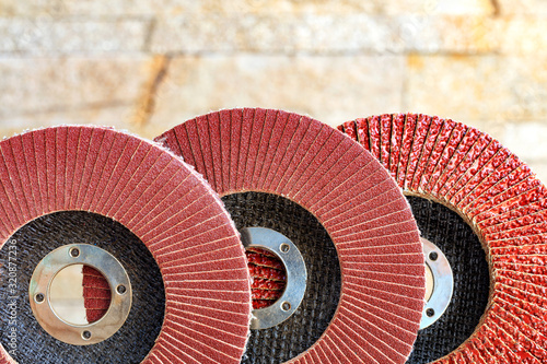 Принти на полотні Set of grinding abrasive emery discs for grinding of the metal, wood and stone on background of golden sandstone