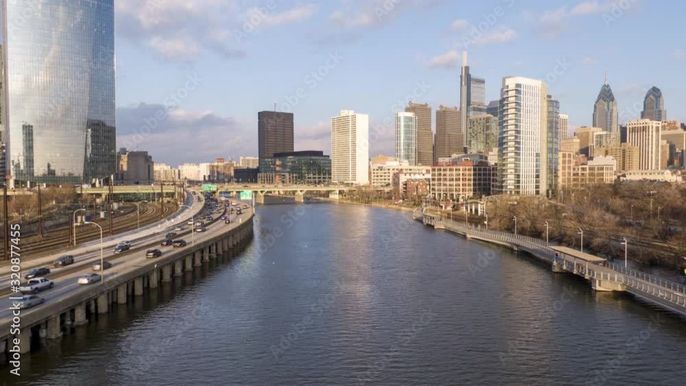Modern metropolis with skyscrapers on the banks of a river, Philadelphia waterfront, aerial hyper-lapse, timelapse Modern metropolis with skyscrapers on the banks of a river, Philadelphia waterfront, aerial hyper-lapse, timelapse