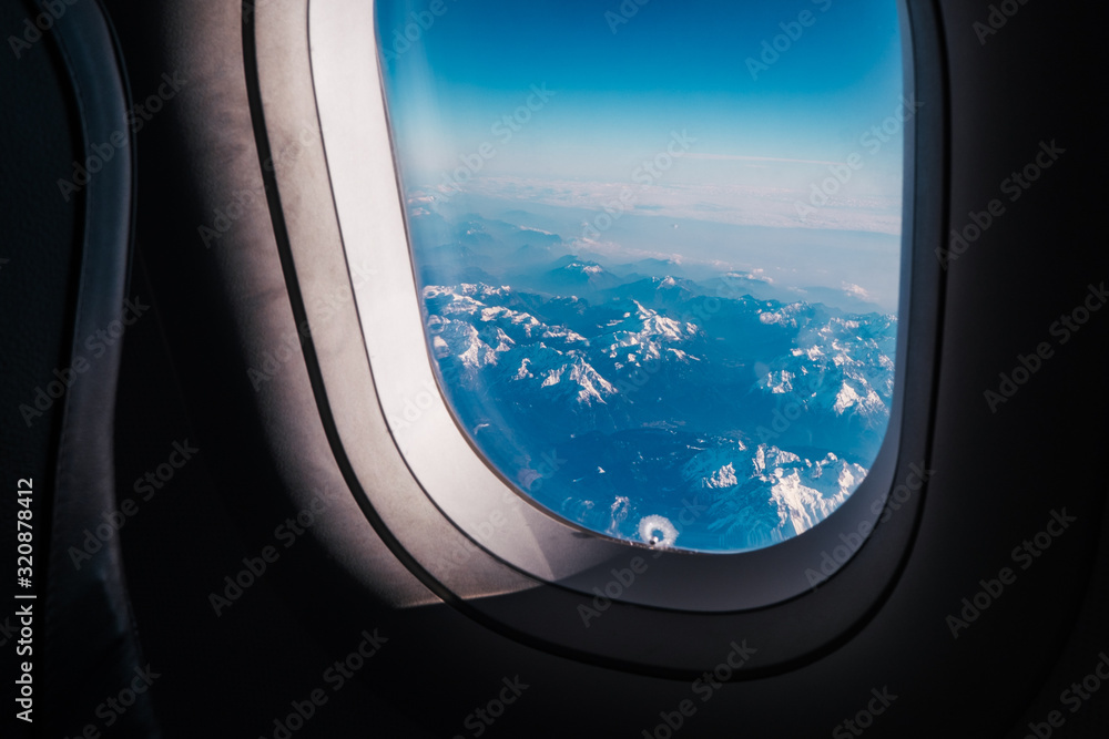 view from the window of the porthole on the mountains of Austria and Switzerland view from the window of the porthole on the mountains of Austria and Switzerland