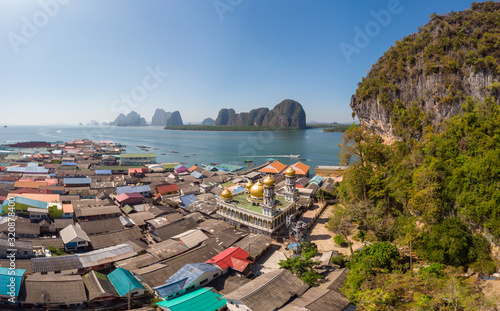 Beautiful landscape mosque sea and sky in summer at Punyi island, Ko Panyi or Koh Panyee, Muslim fisherman village landmark attractions travel by boat at Ao Phang Nga Bay National Park, Thailand, Asia photo