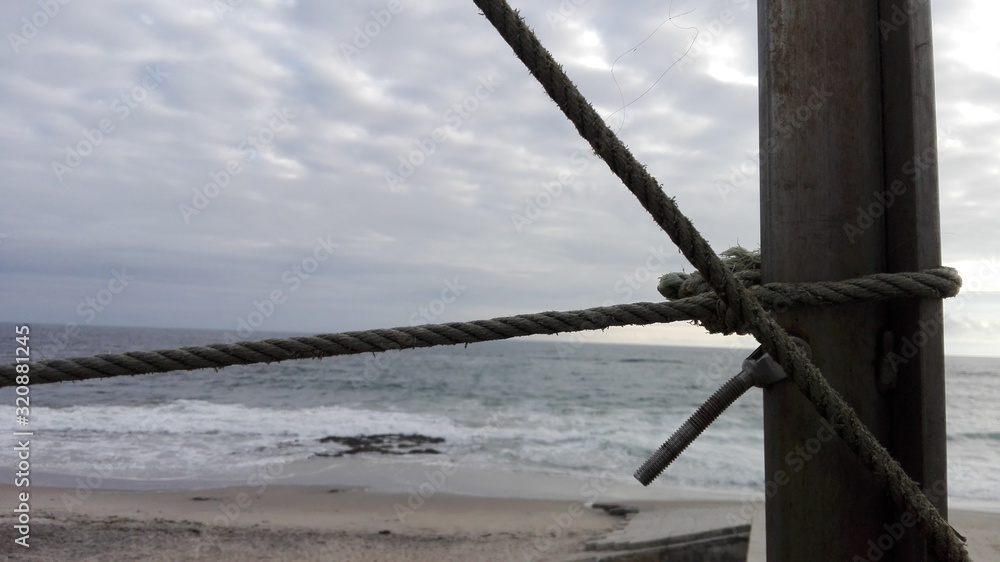 Obraz premium fishing boat on the beach rope sailing