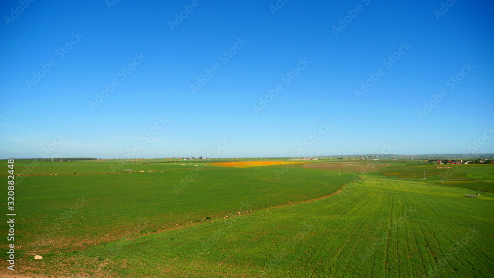 Bright landscape of Morocco, breathtaking curves of mountains, stunning combination of hills & farm land,inadvertent distribution of houses & huts, raw impression of pure nature. Bright landscape of Morocco, breathtaking curves of mountains, stunning combination of hills & farm land,inadvertent distribution of houses & huts, raw impression of pure nature.