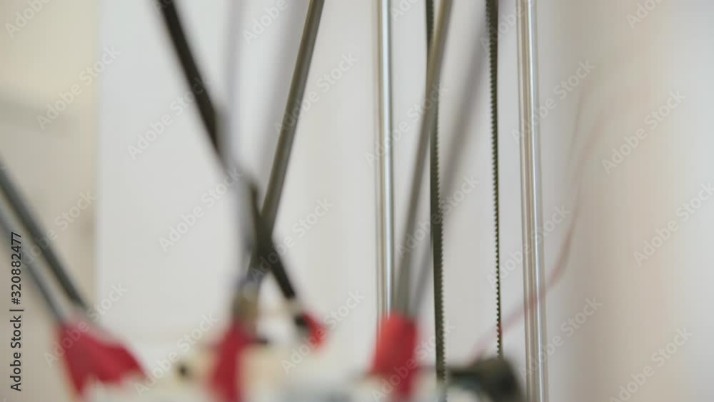 macro shot 3d printer parts axis wires moving rapidly daylight macro shot 3d printer parts axis wires moving rapidly daylight