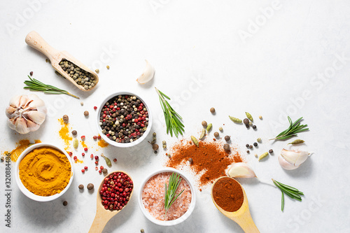 Fototapeta Naklejka Na Ścianę i Meble -  Aromatic spices and herbs mix on white marble table with copy space for your text.