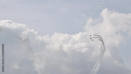 3 fighter jets in the blue sky. A general plan. Aerobatic figures. Airshow. 8 seconds photo