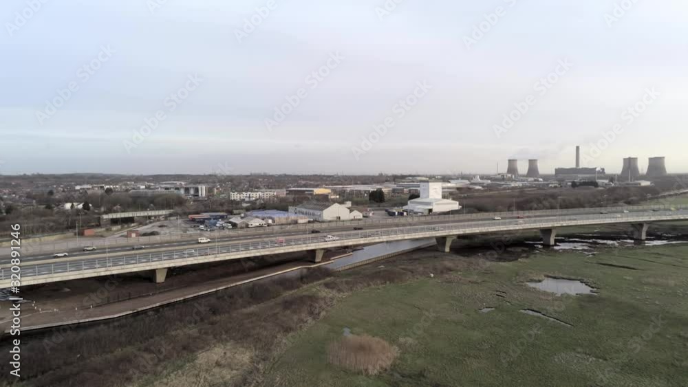 Aerial view of traffic vehicles on Mersey gateway motorway landmark bridge crossing & regeneration infrastructure. Orbit right. Aerial view of traffic vehicles on Mersey gateway motorway landmark bridge crossing & regeneration infrastructure. Orbit right.