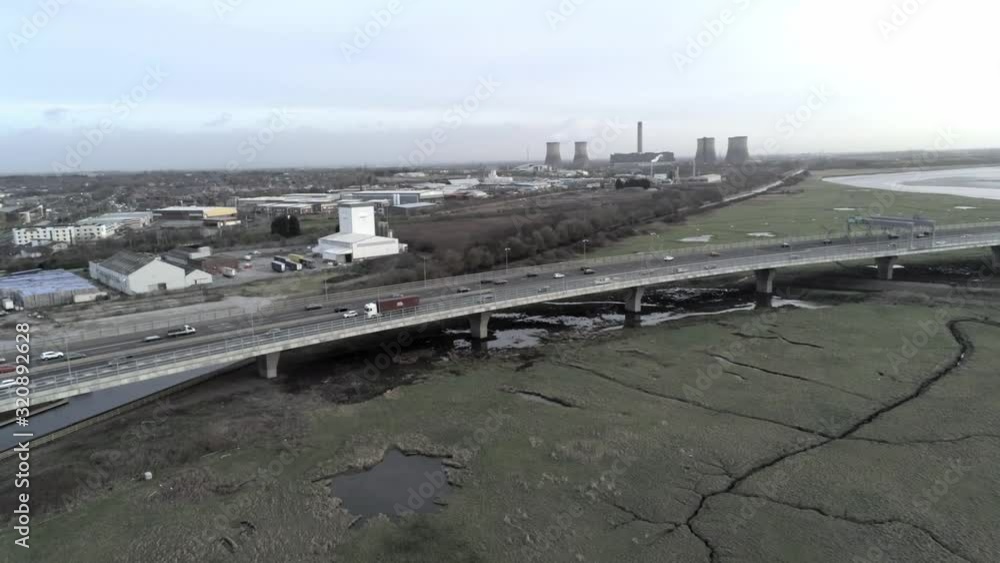 Highway intersection UK, Elevated aerial view cityscape urban vehicle traffic bridge off ramp lanes. Orbit left. Highway intersection UK, Elevated aerial view cityscape urban vehicle traffic bridge off ramp lanes. Orbit left.