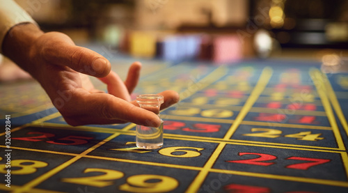 Croupier hand indicates the winning sector on the roulette table.