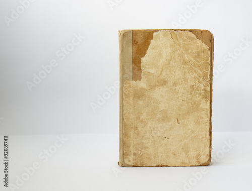 Old book on a light wall background