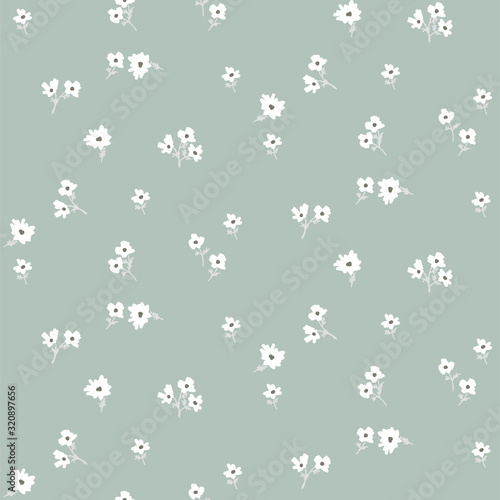 Seamless ditsy white floral pattern with tiny leaves hand drawn style blue colors.