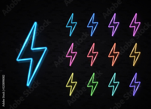 Realistic color 3d neon sign of energy lightning bolt set for decoration covering on black brick wall background. Lightning thunder design concept. Light electricity symbol. Bright vector illustration