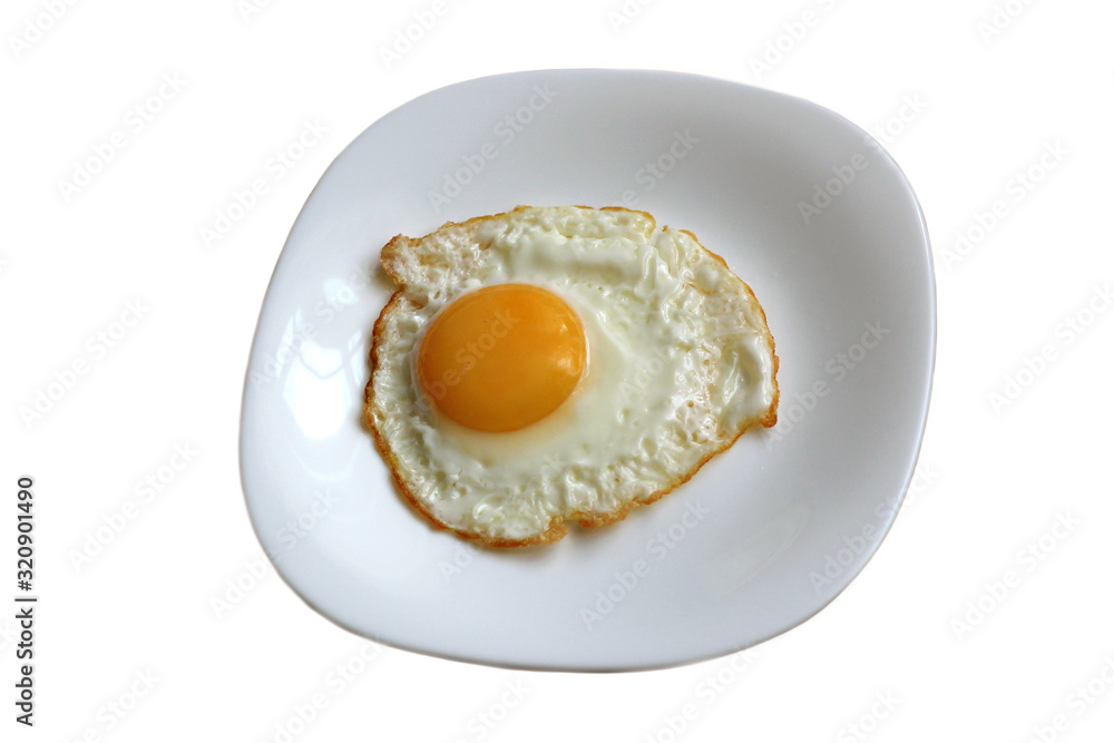 fried egg on a white plate fried egg on a white plate