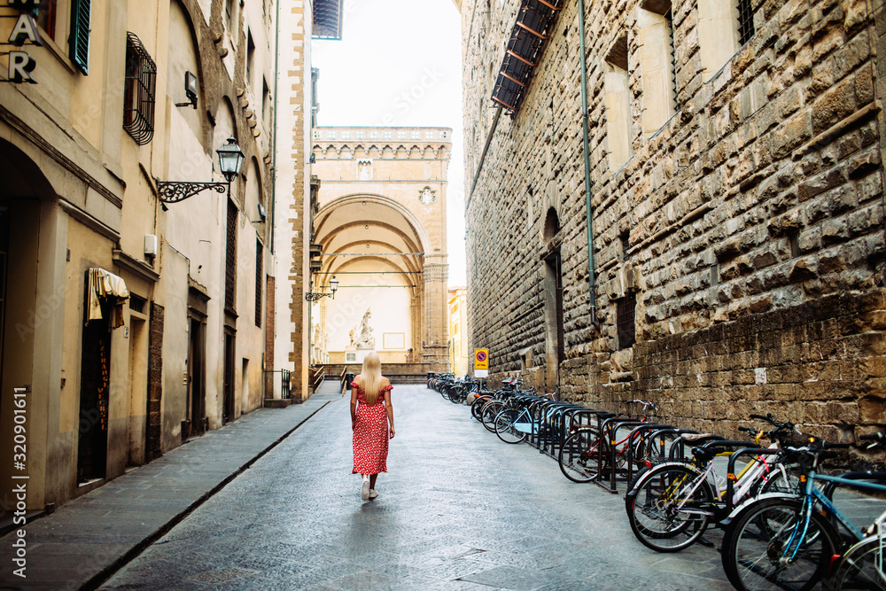 Woman walking at old town in Florence.