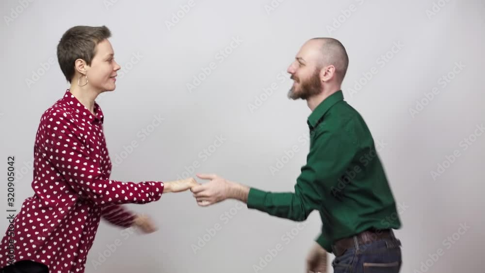 Swing dancers on white background. Man and woman are dancing lindy hop or boogie woogie dance. Happy couple dancing. Swing dancers on white background. Man and woman are dancing lindy hop or boogie woogie dance. Happy couple dancing.