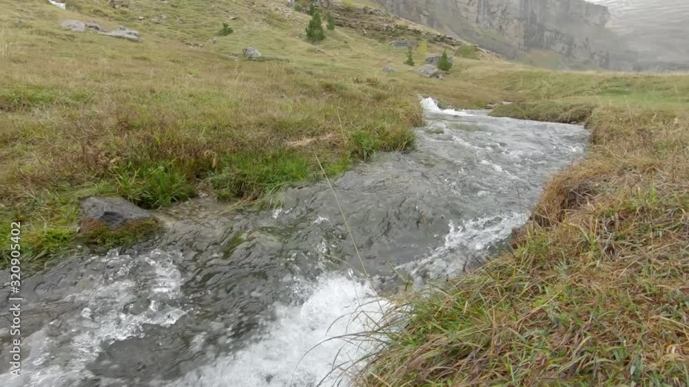 Mountain spring flow in Ordesa Monte Peridio National Park Pyrenees Mountain spring flow in Ordesa Monte Peridio National Park Pyrenees