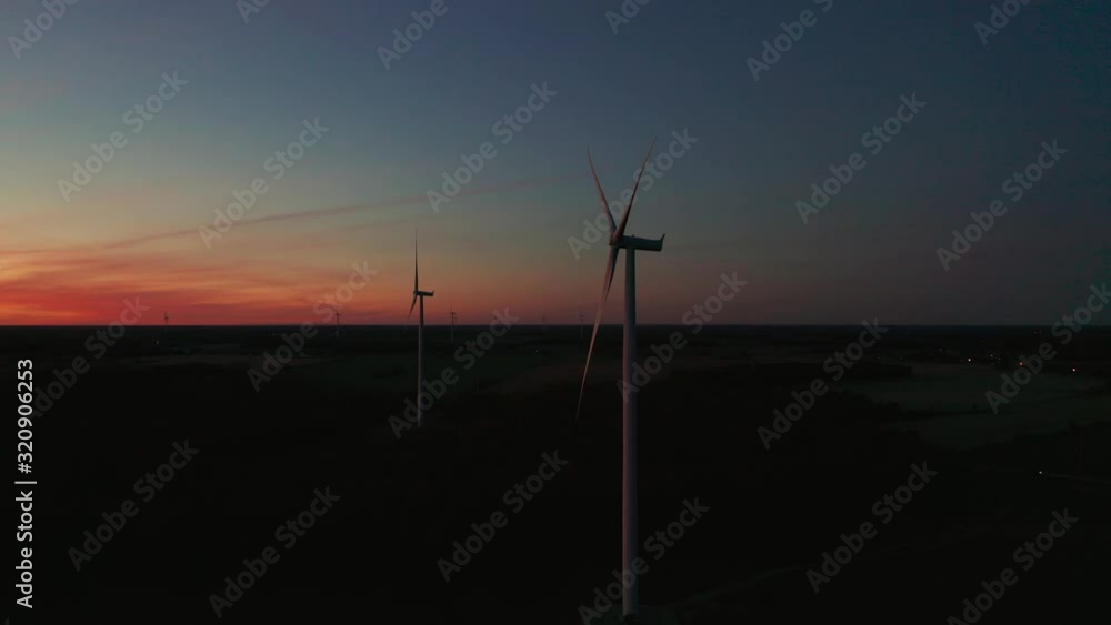 Aerial orbiting around a wind turbine on a beautiful sunset Aerial orbiting around a wind turbine on a beautiful sunset