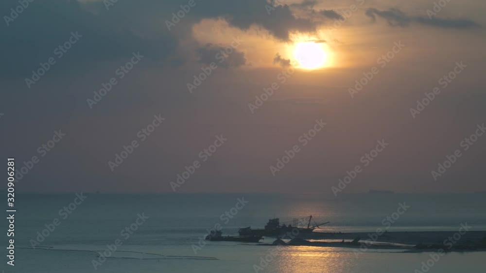 The sun setting over a shipwreck by the shores of Melaka - time lapse The sun setting over a shipwreck by the shores of Melaka - time lapse