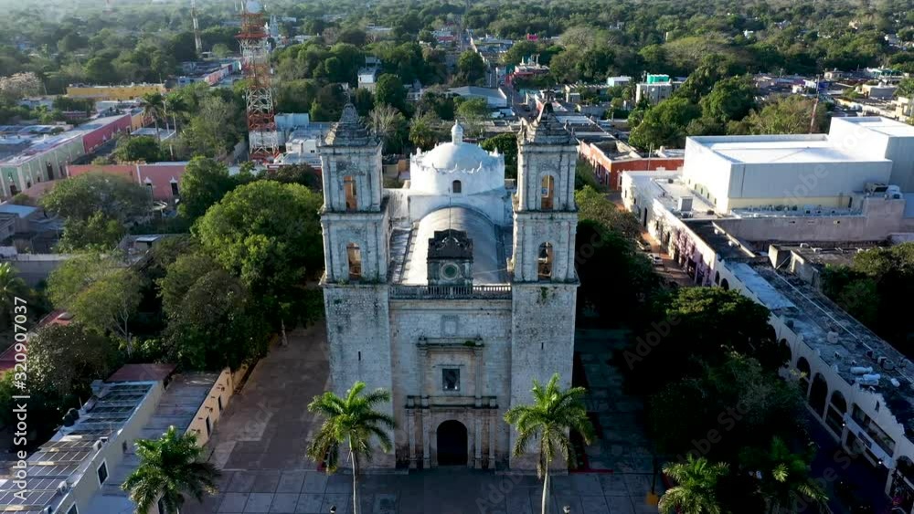 Aerial push in and tilt down onto the Cathedral de San Gervasio just after sunrise in Valladolid, Yucatan, Mexico. Aerial push in and tilt down onto the Cathedral de San Gervasio just after sunrise in Valladolid, Yucatan, Mexico.