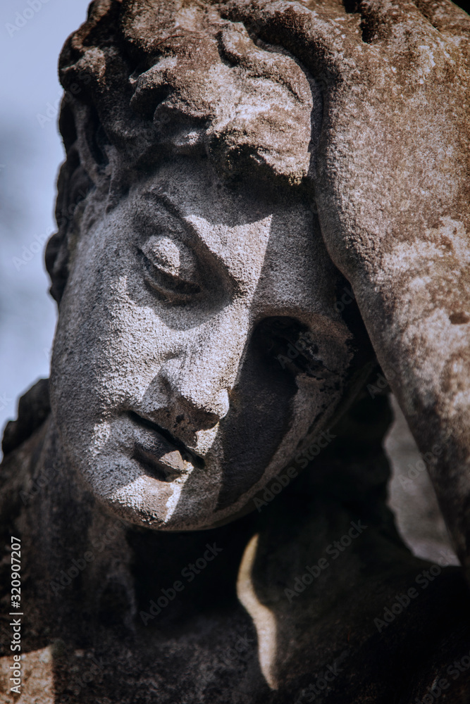 Obraz premium Sad eyes of beautiful angel. Fragment of ancient statue. Death, pain and end of life concept.