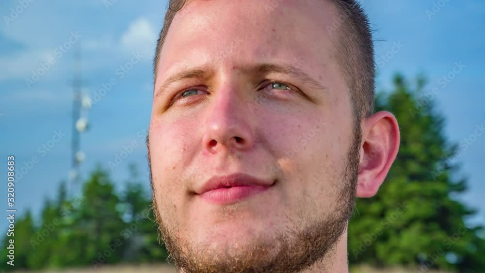 Close up on man face with beard staring. Pan Close up on man face with beard staring. Pan