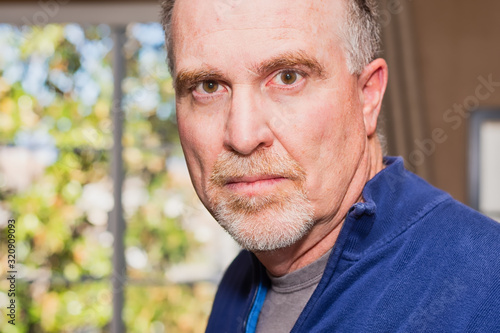 senior man stares close view