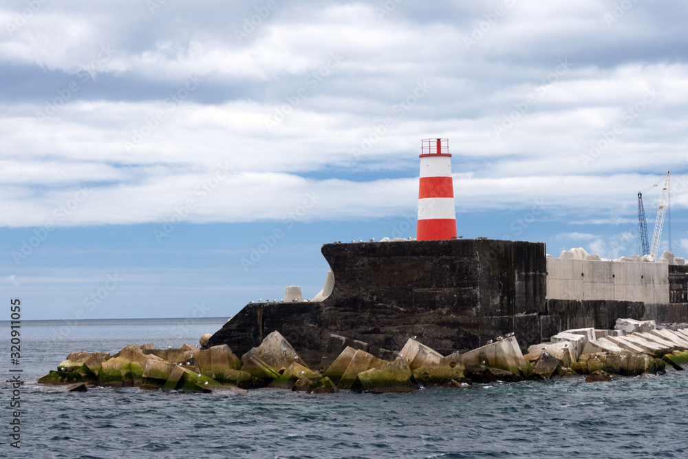 Portugal, Ponta Delgada, Azores. Old beautiful lighthouse. The island of San Miguel. Portugal, Ponta Delgada, Azores. Old beautiful lighthouse. The island of San Miguel.
