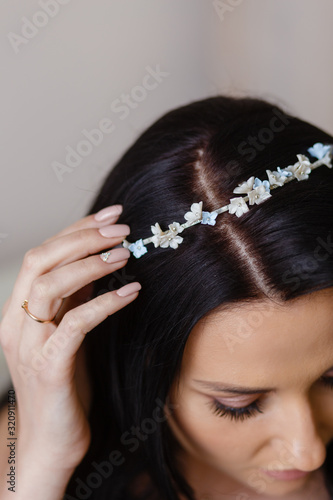 Hoop in the hair of the bride. Wedding hair decoration