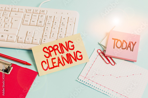 Obraz na płótnie Handwriting text Spring Cleaning. Conceptual photo thorough cleaning of a house or room during spring Paper blue desk computer keyboard office study notebook chart numbers memo w salonie