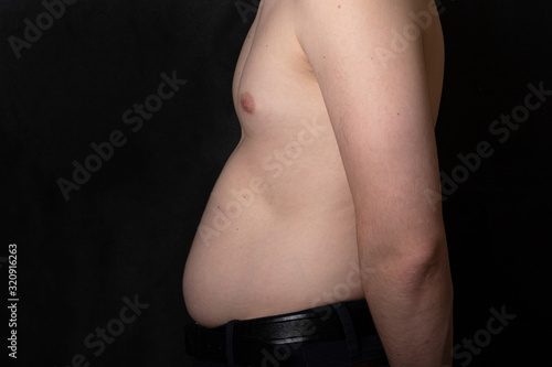 overweight male stomach in profile.