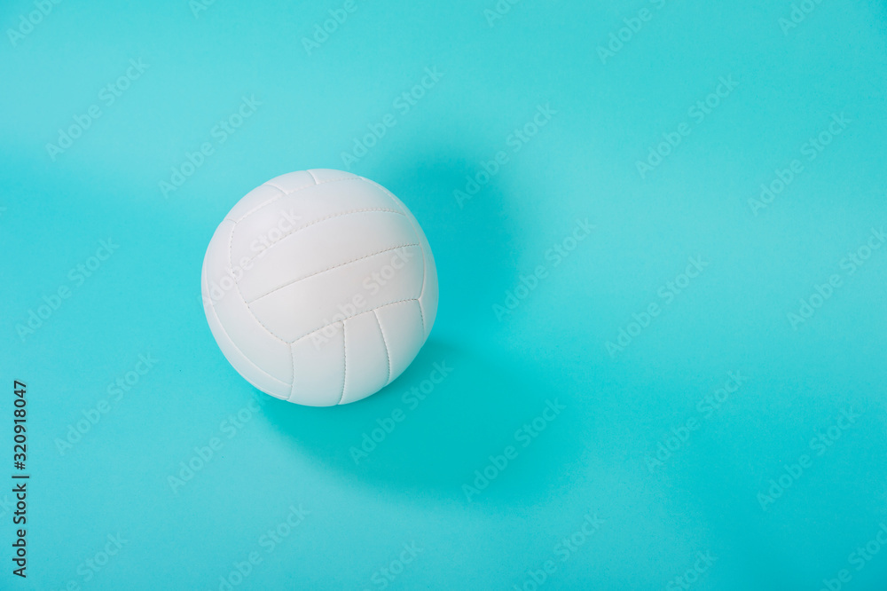 Volleyball ball isolated on blue background.