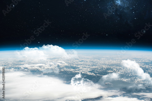 Orbit of planet Earth with sky and clouds in outer space. Our home. Stratosphere. Way of ISS. Elements of this image furnished by NASA