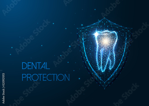 Futuristic dental protection concept with glowing low polygonal molar tooth and protective shield