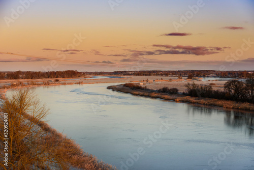 River Lielupe and lands of Jelgava  during winter sunrise.